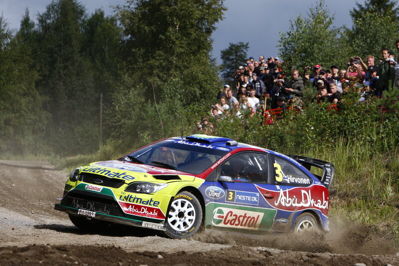 rally car racing on dirt road