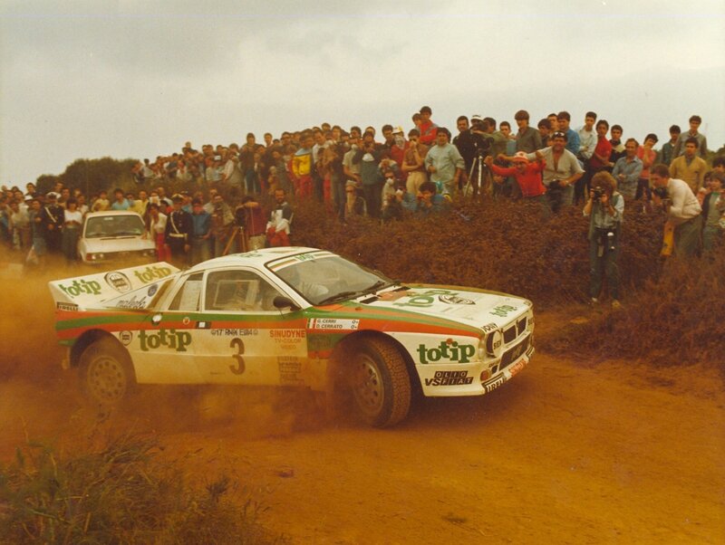 Rally car racing on dirt track
