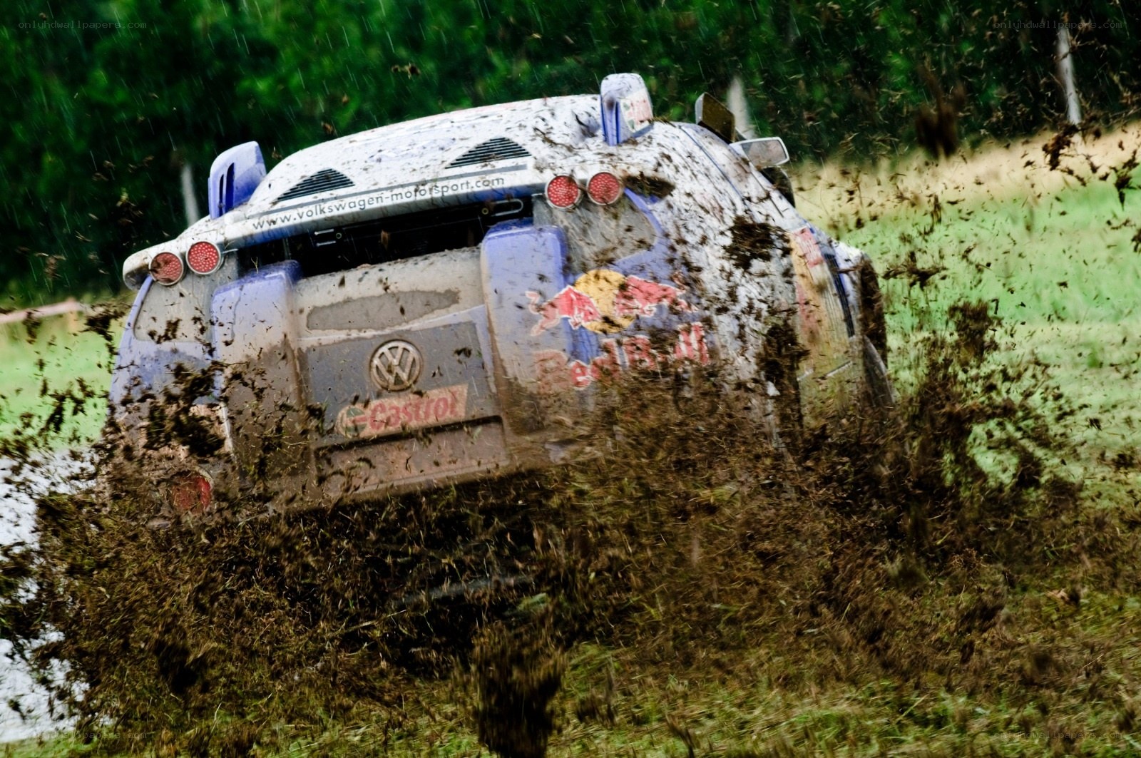 Rally car splashing mud