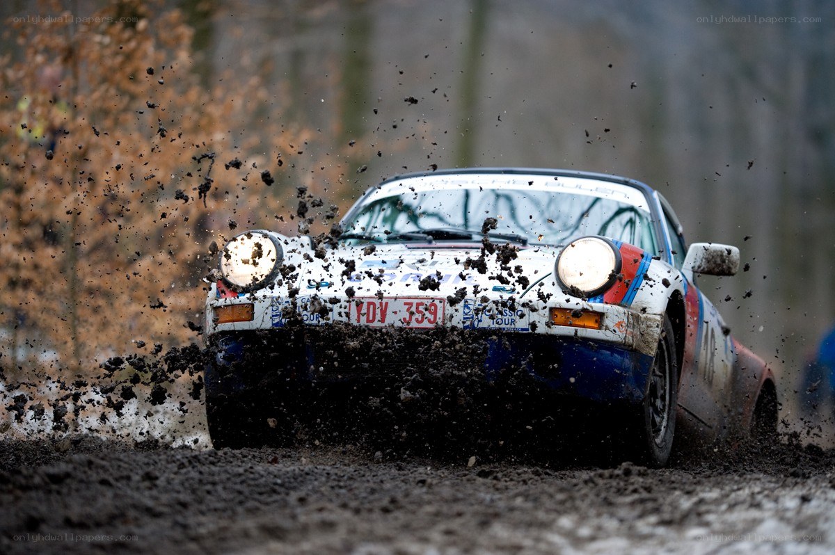 Rally car splashing mud