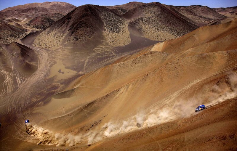 Rally cars in desert dunes