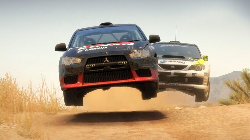 Rally cars in mid-air jump