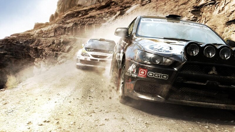 rally cars on dusty road