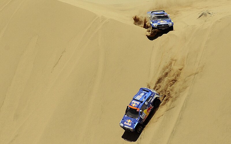 Rally cars on sand dunes