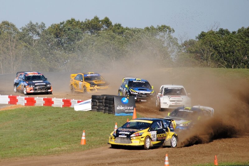 Rally cars racing on dirt track
