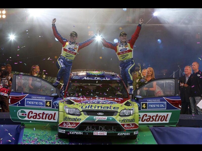Rally drivers celebrate on podium