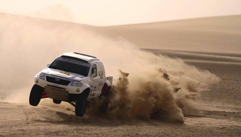 Rally truck in desert sand