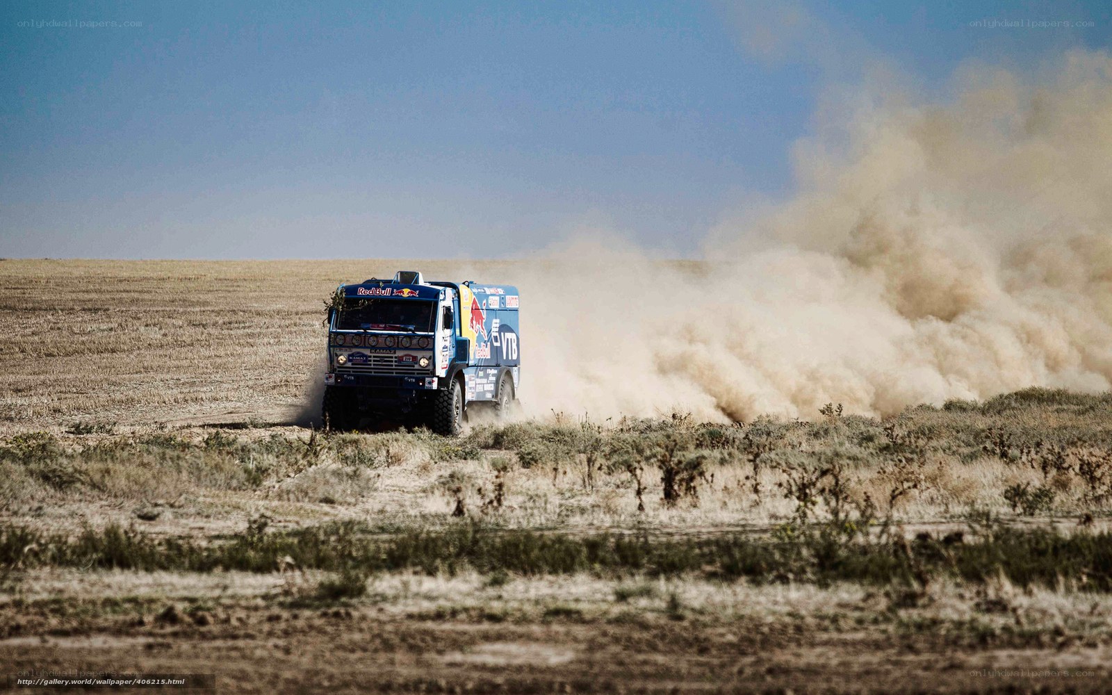 Rally truck in dusty field