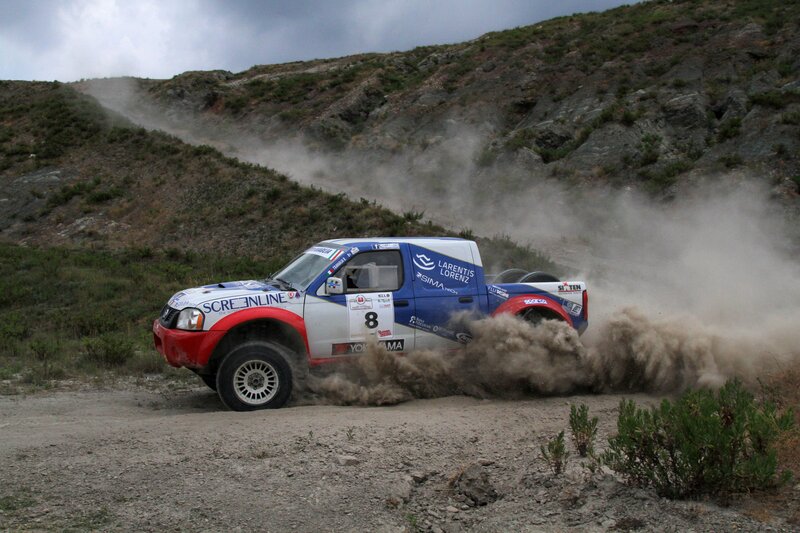 Rally Truck Kicking Up Dust — Blue