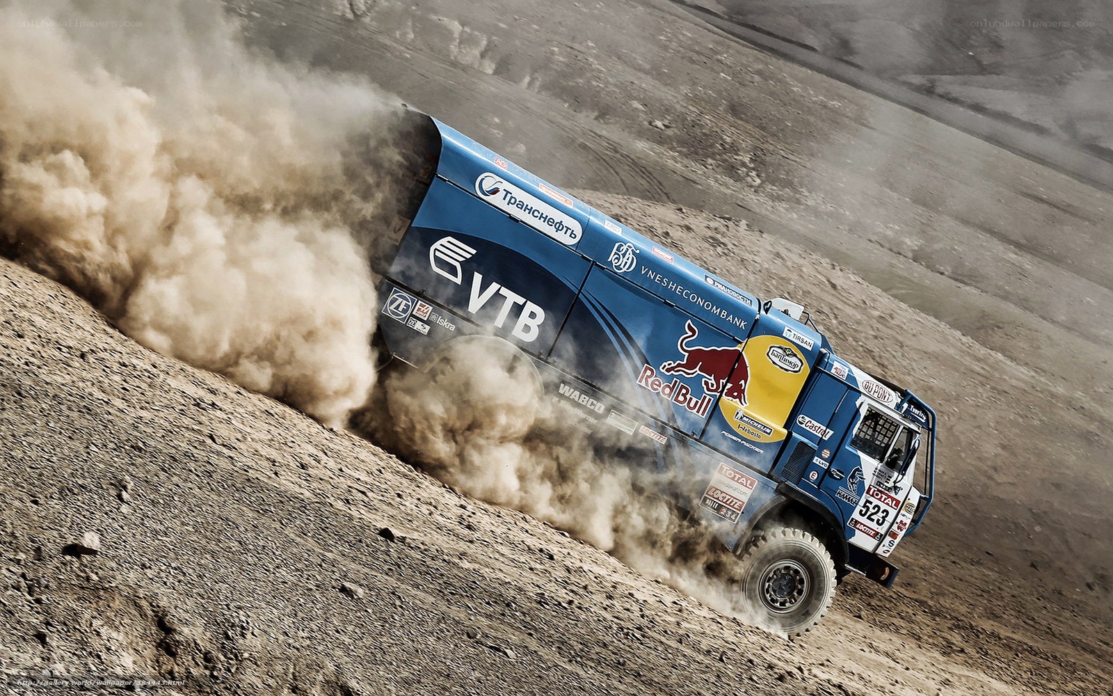 Rally truck on dusty terrain