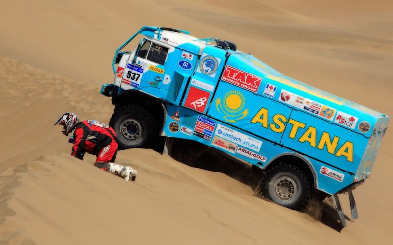Rally truck on sand dune