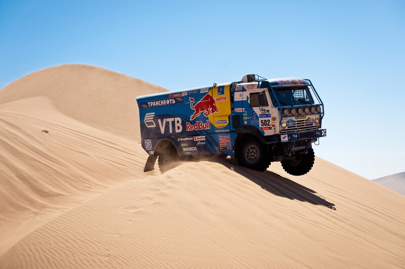 Rally truck on sand dune