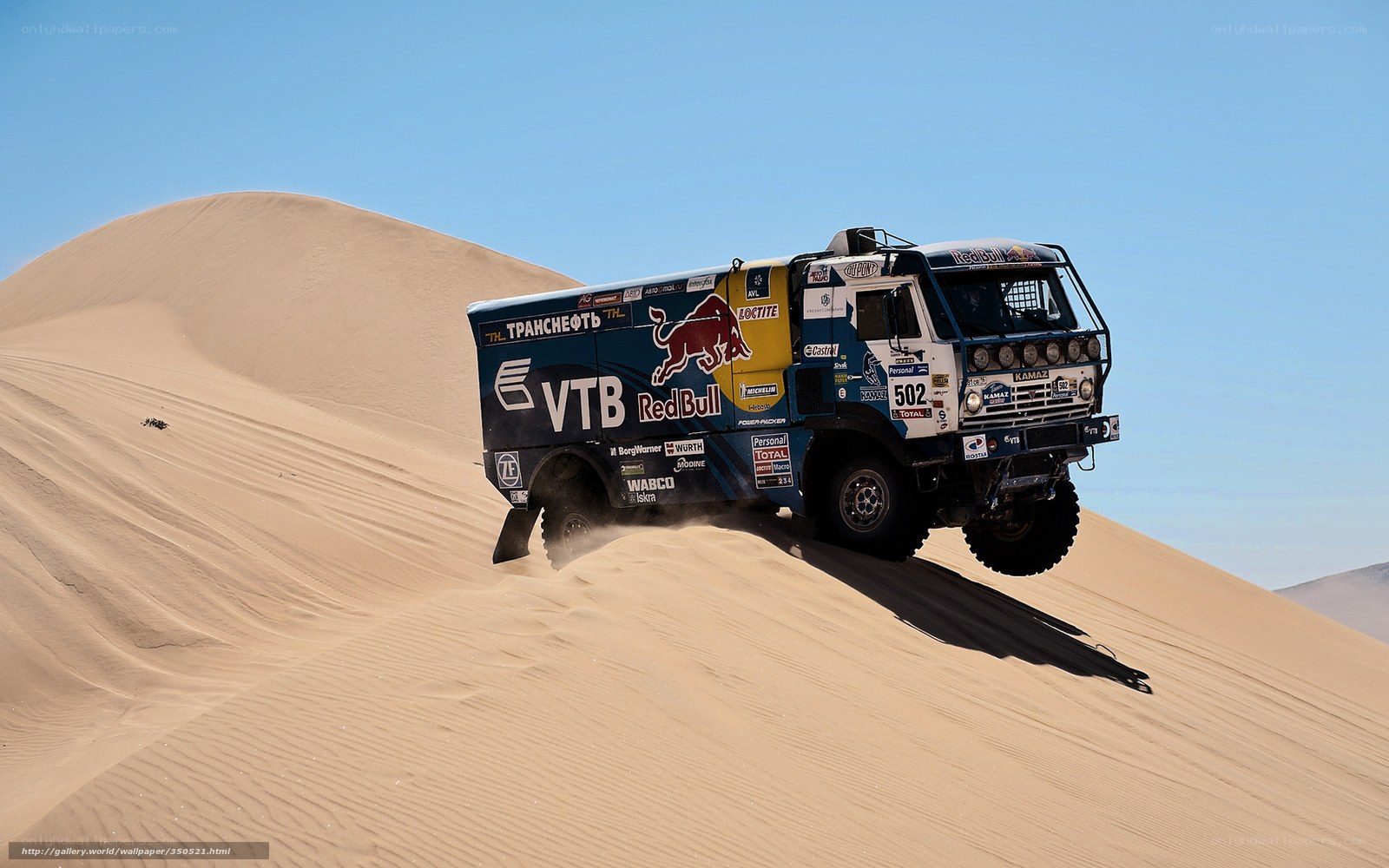 Rally truck on sand dune