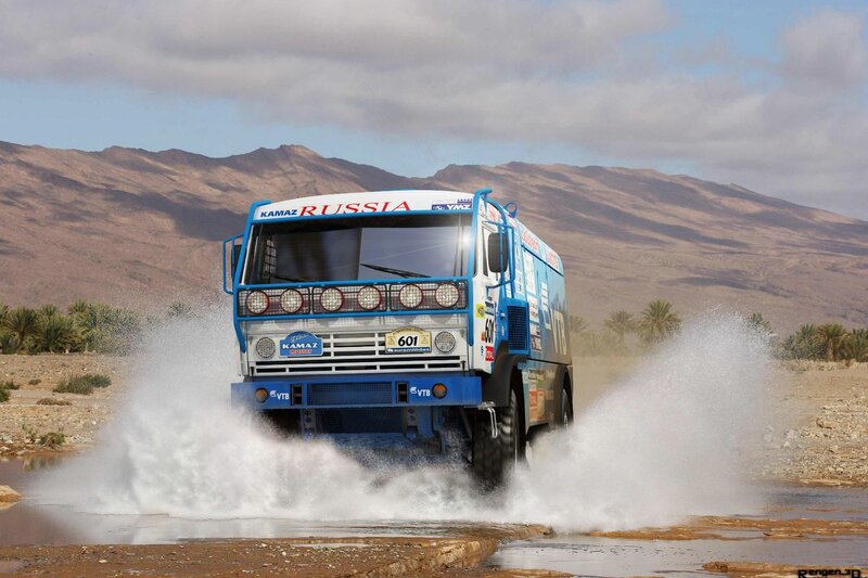 rally truck splashing through water