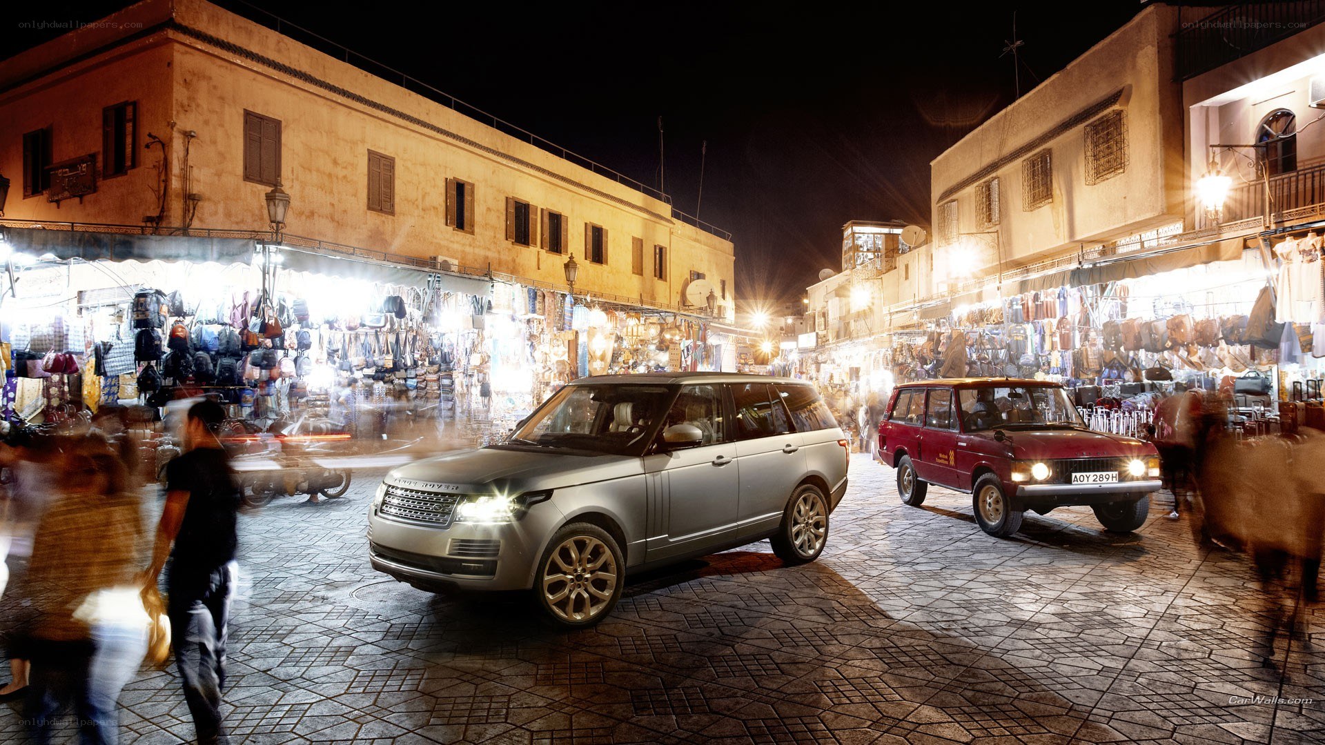 Range Rover in a bustling market