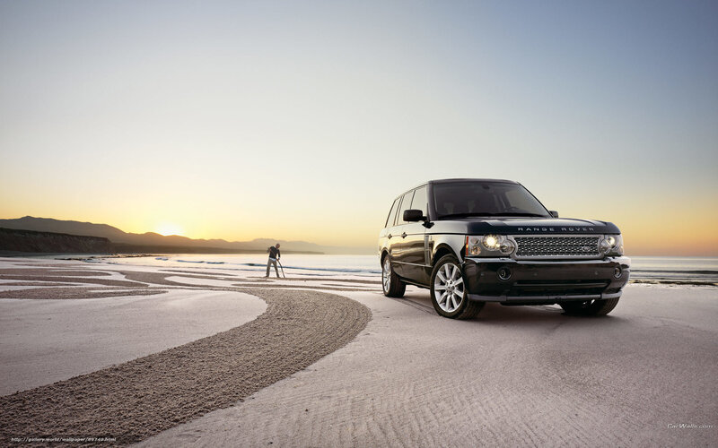 Range Rover on beach at sunset