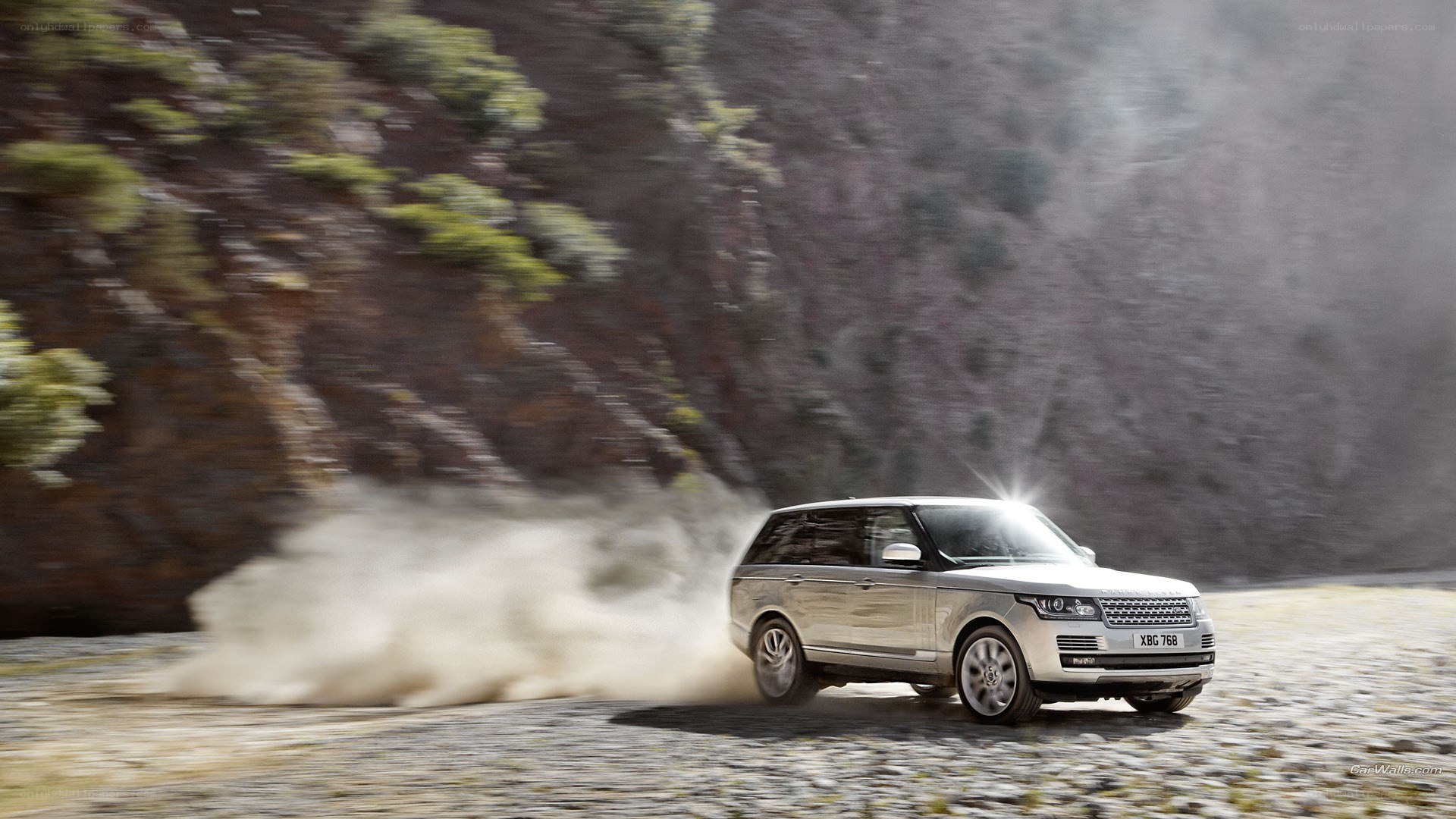 Range Rover on dusty road
