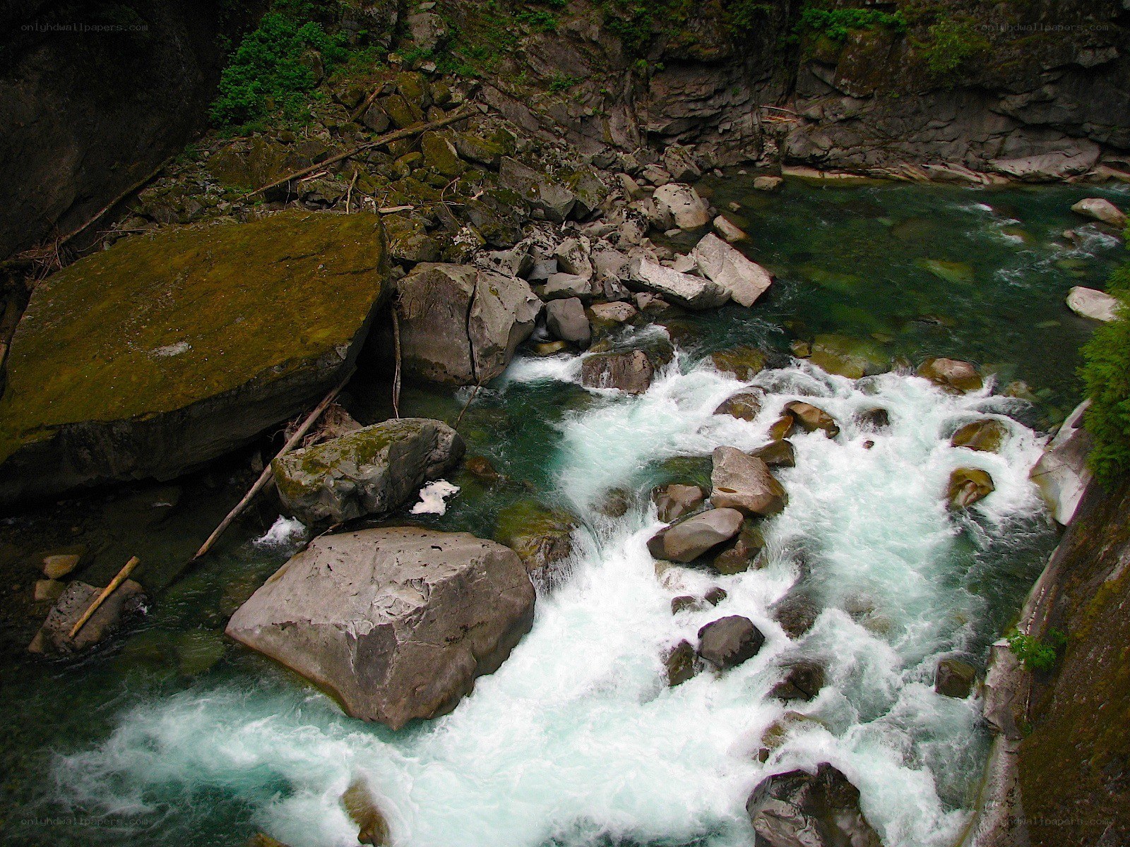 Rapid river through rocky canyon