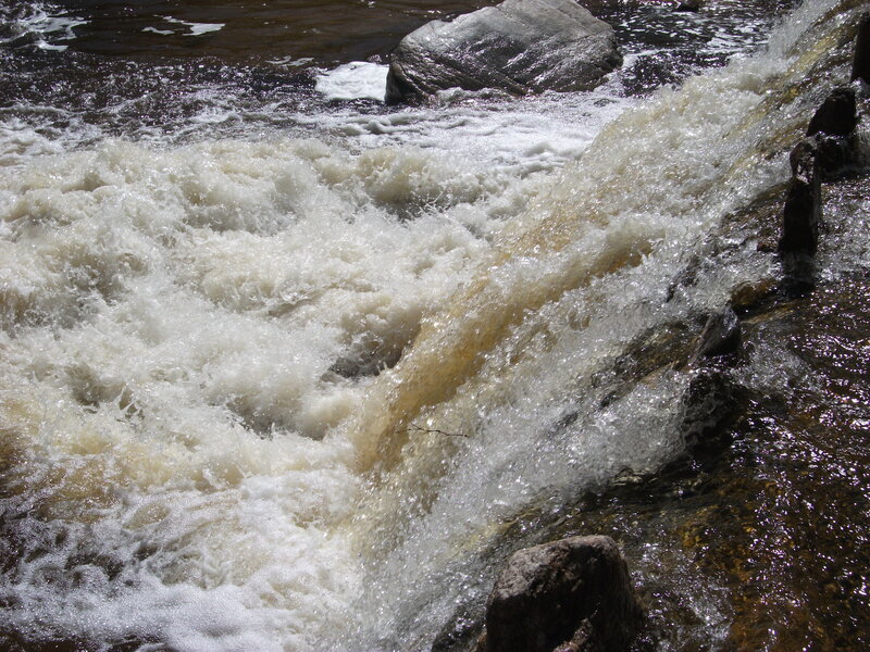 Rapids Flowing over Rocks — White