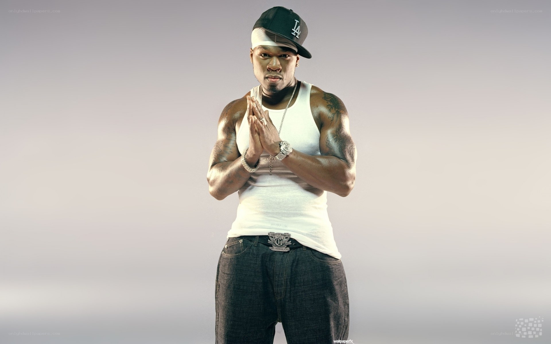 rapper in white tank top