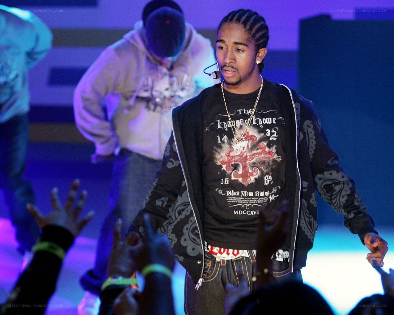 rapper on stage performing