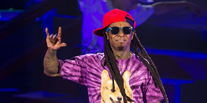 rapper on stage with dog t-shirt