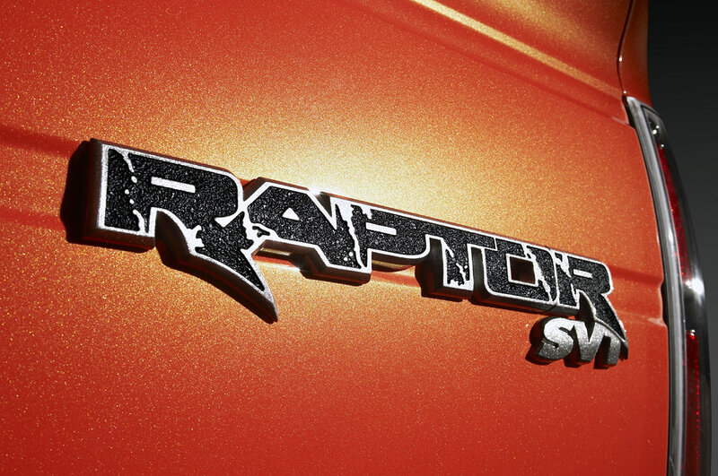 Raptor SVT badge on orange truck