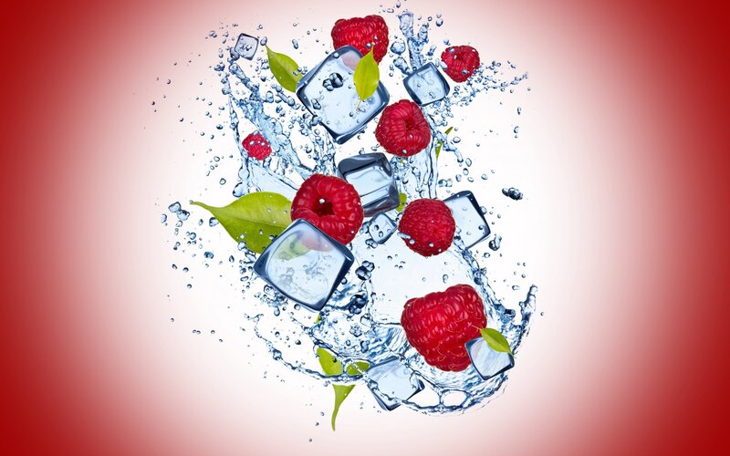Raspberries and ice in water splash