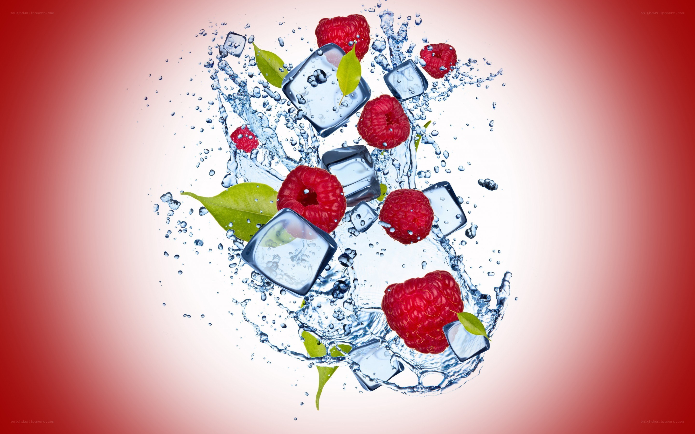 Raspberries and ice in water splash