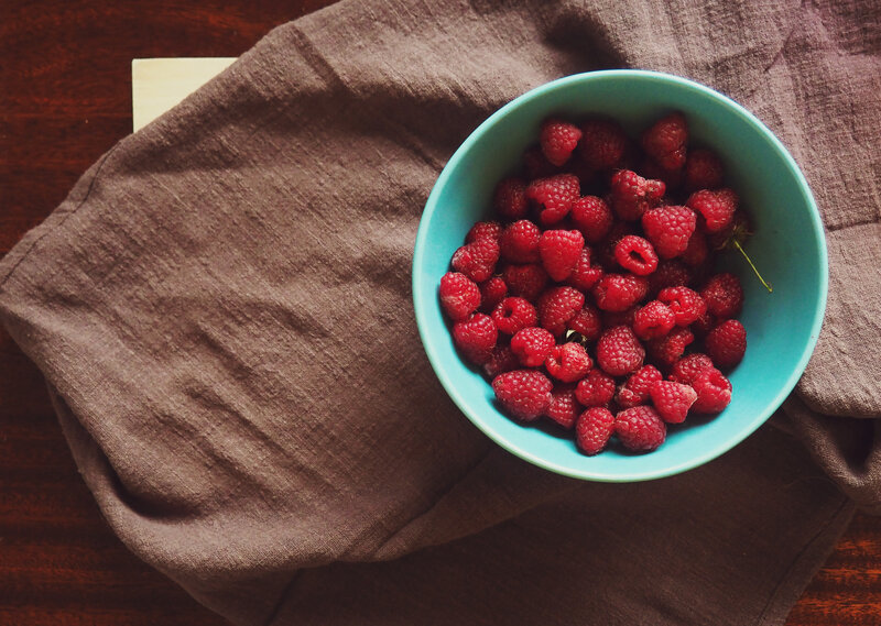 Raspberries in a blue bowl
