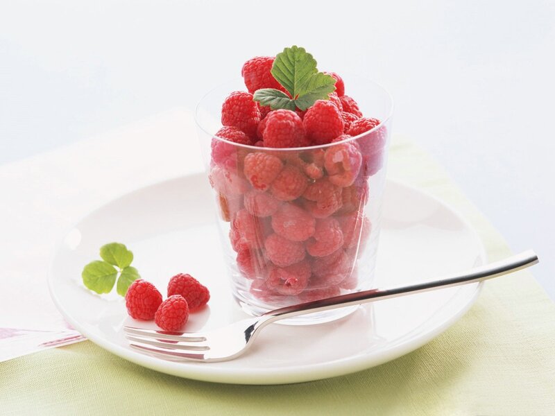 Raspberries in a glass cup