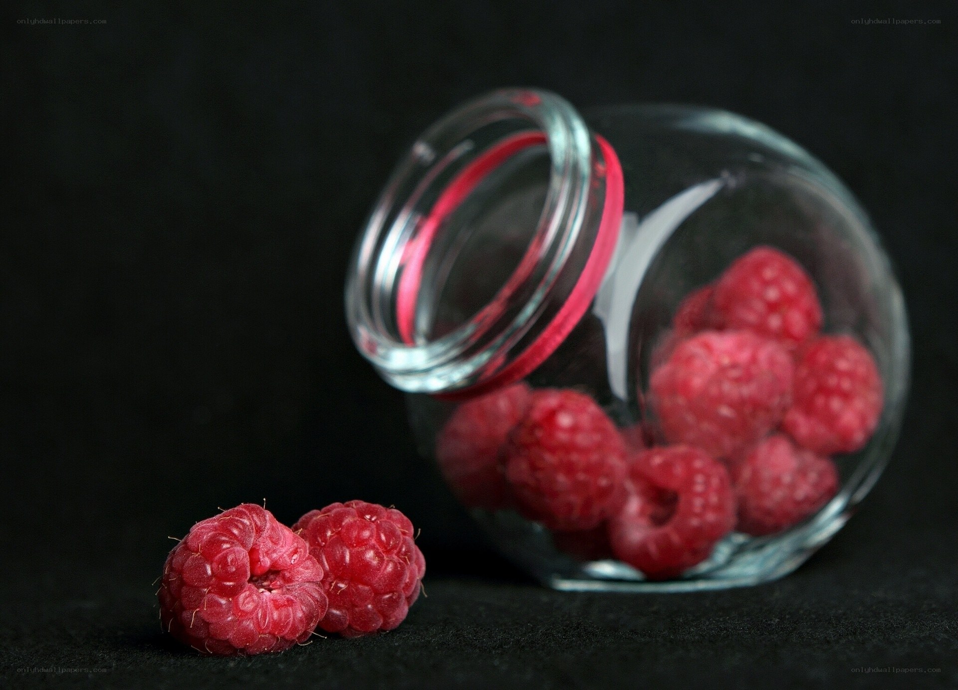 Raspberries in a glass jar