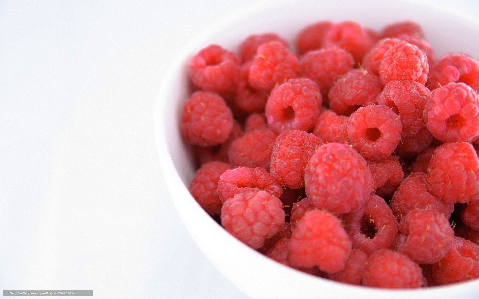 Raspberries in a white bowl