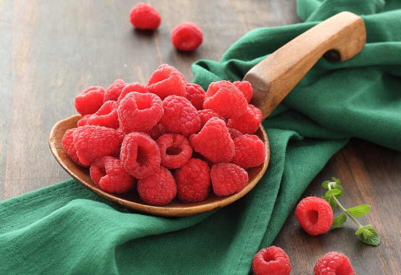 Raspberries in a wooden bowl