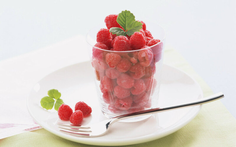 Raspberries in Glass Cup