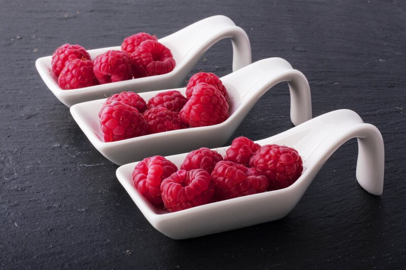 Raspberries in White Bowls