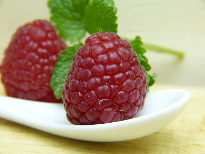 Raspberries with mint leaves