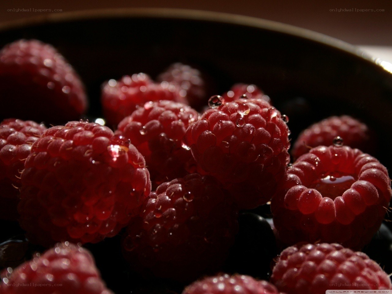 Raspberries with water droplets