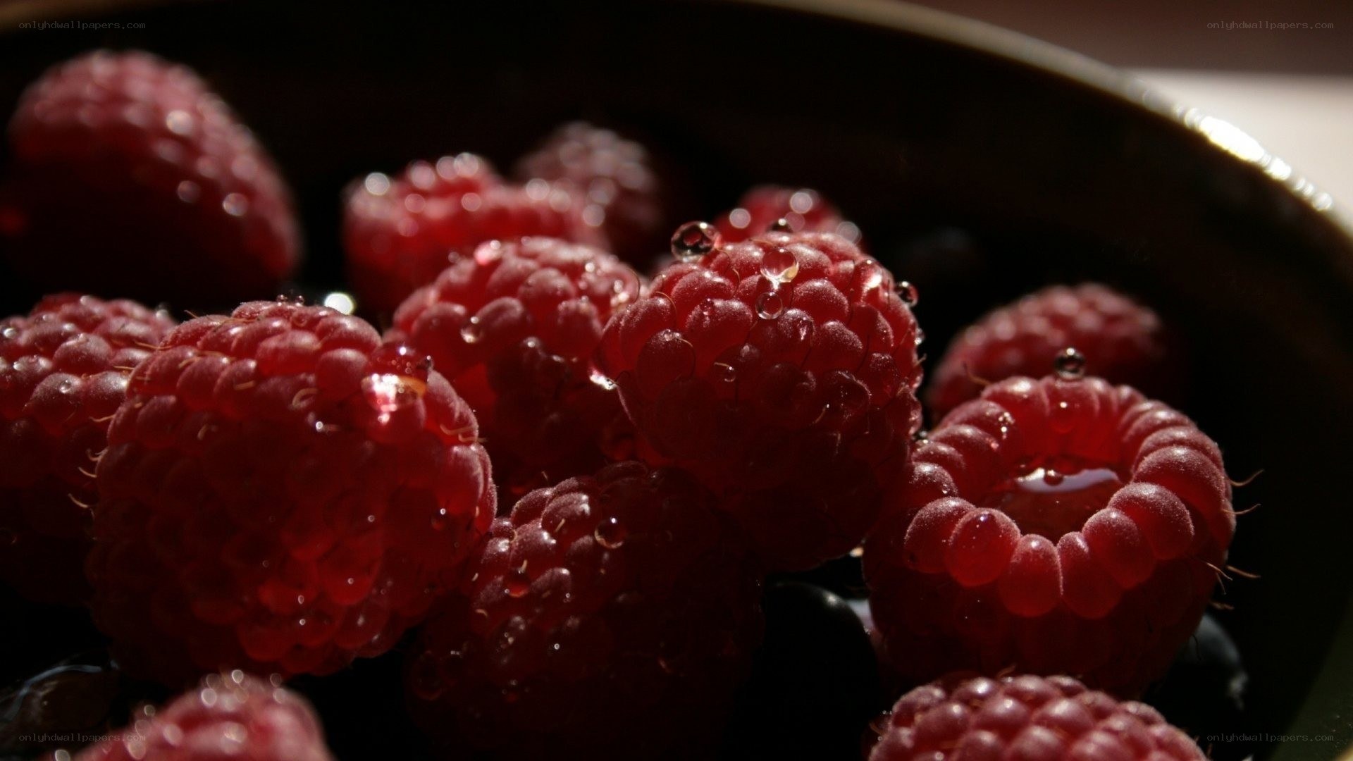 Raspberries with water droplets