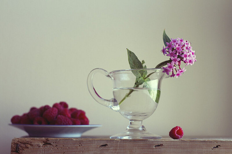 Raspberry and Flower in Glass