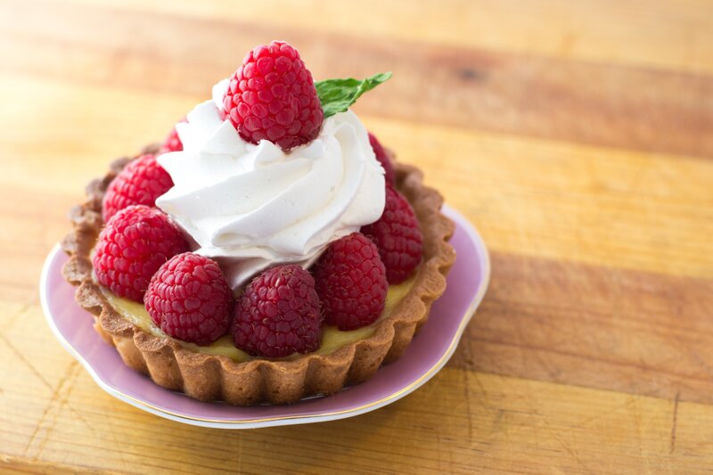 Raspberry tart with whipped cream