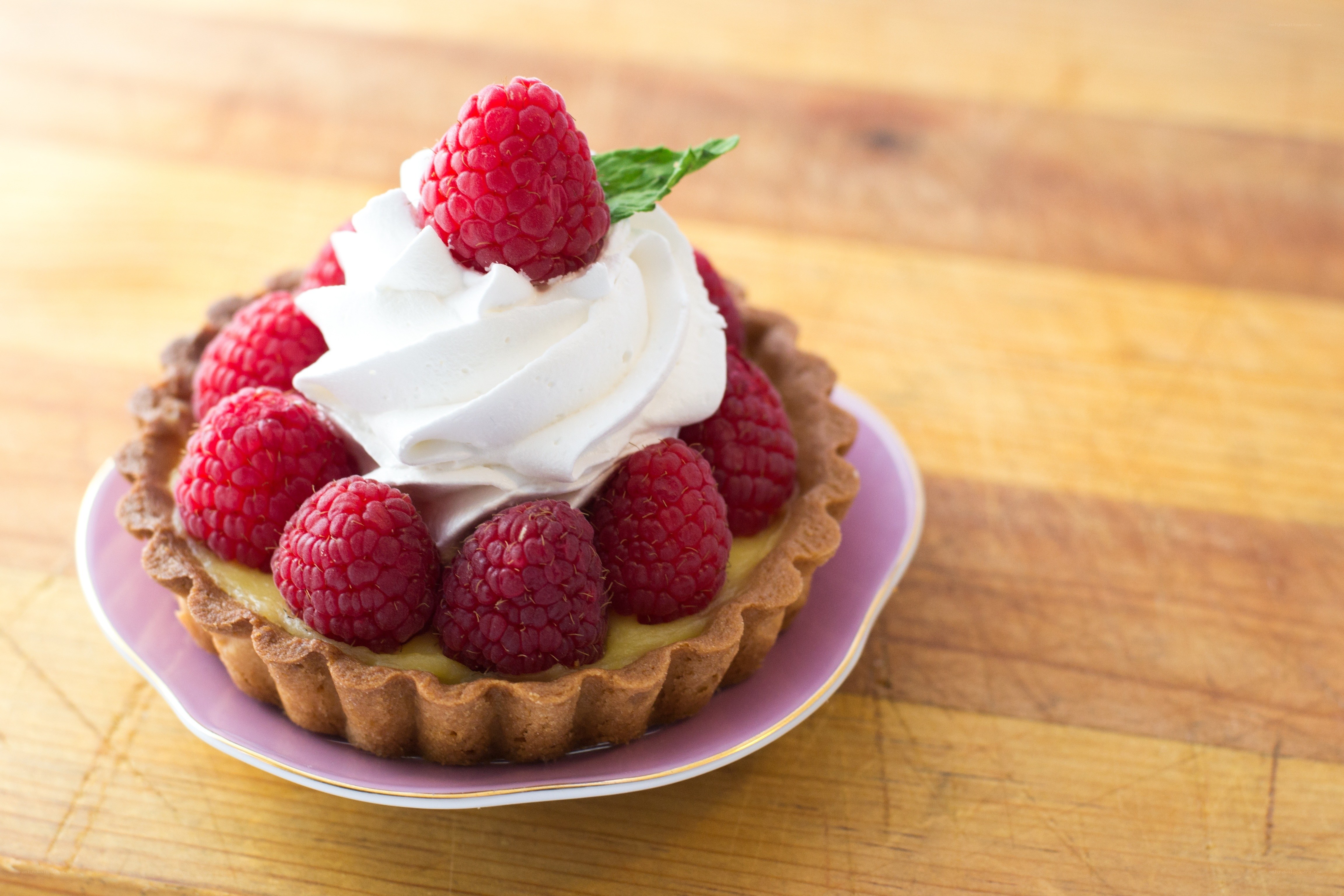 Raspberry tart with whipped cream