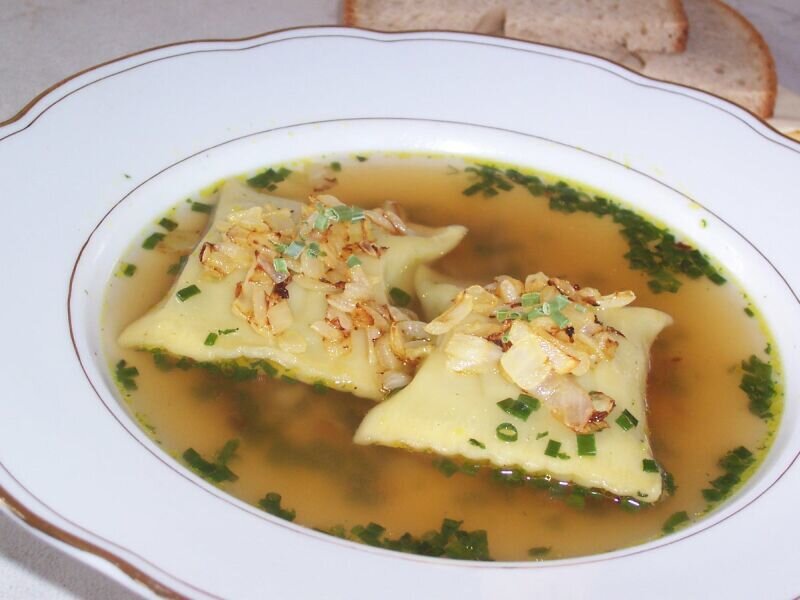 Ravioli soup with herbs