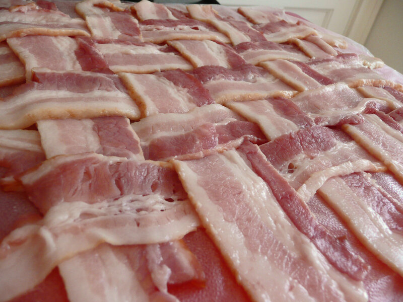 raw bacon strips arranged in a lattice