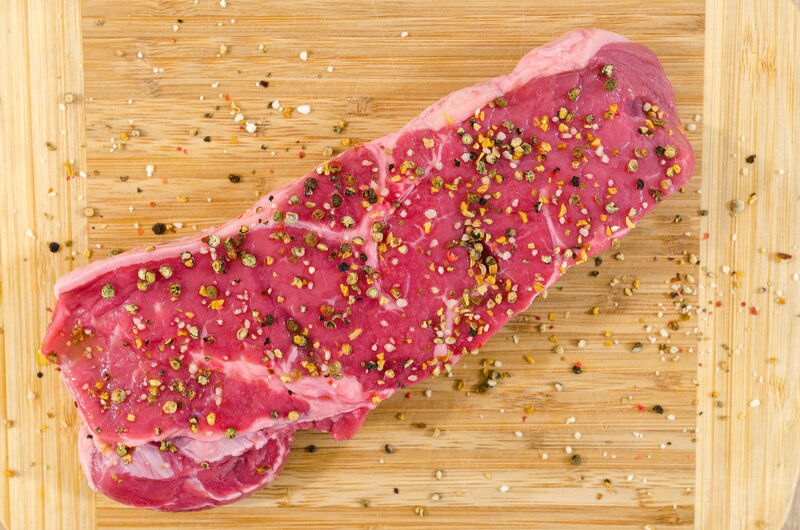 Raw Meat on Cutting Board — Red