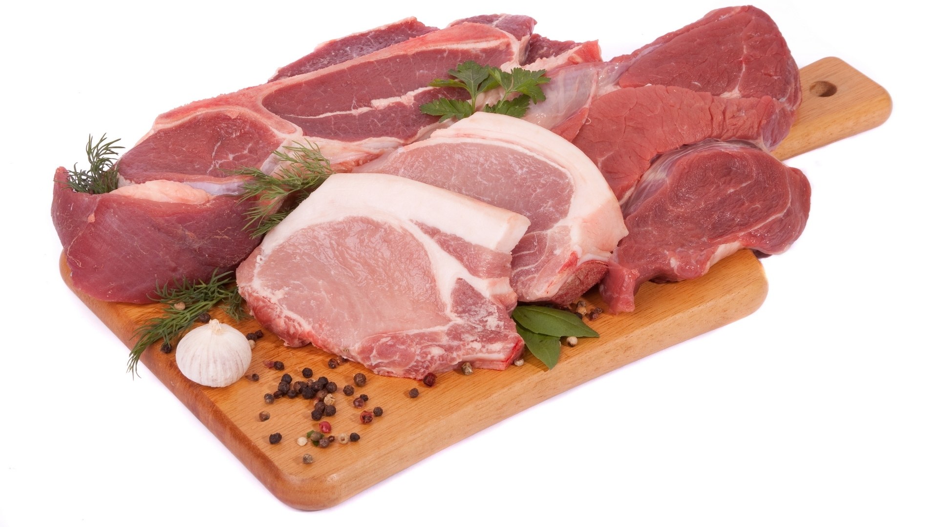 raw meat on wooden board