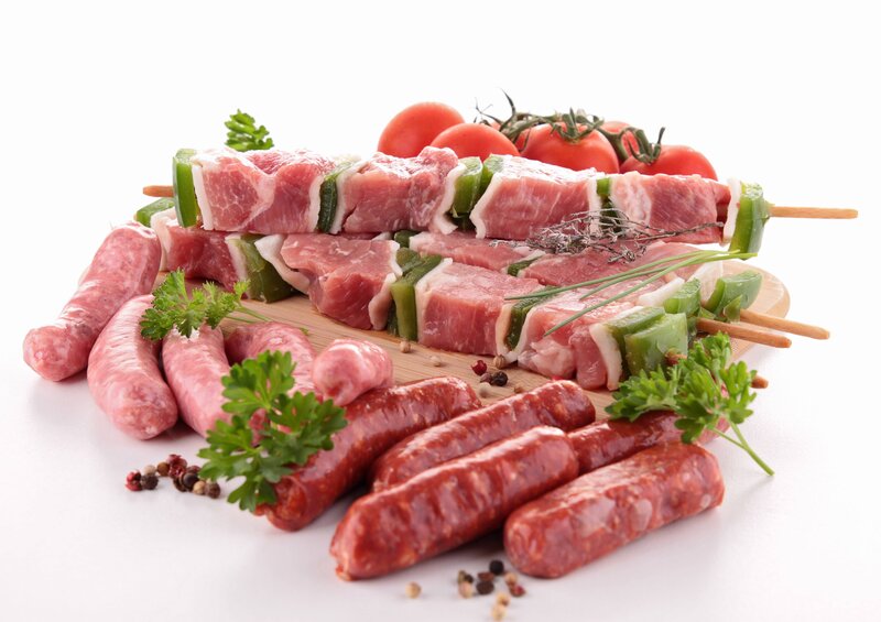 Raw meat skewers and sausages