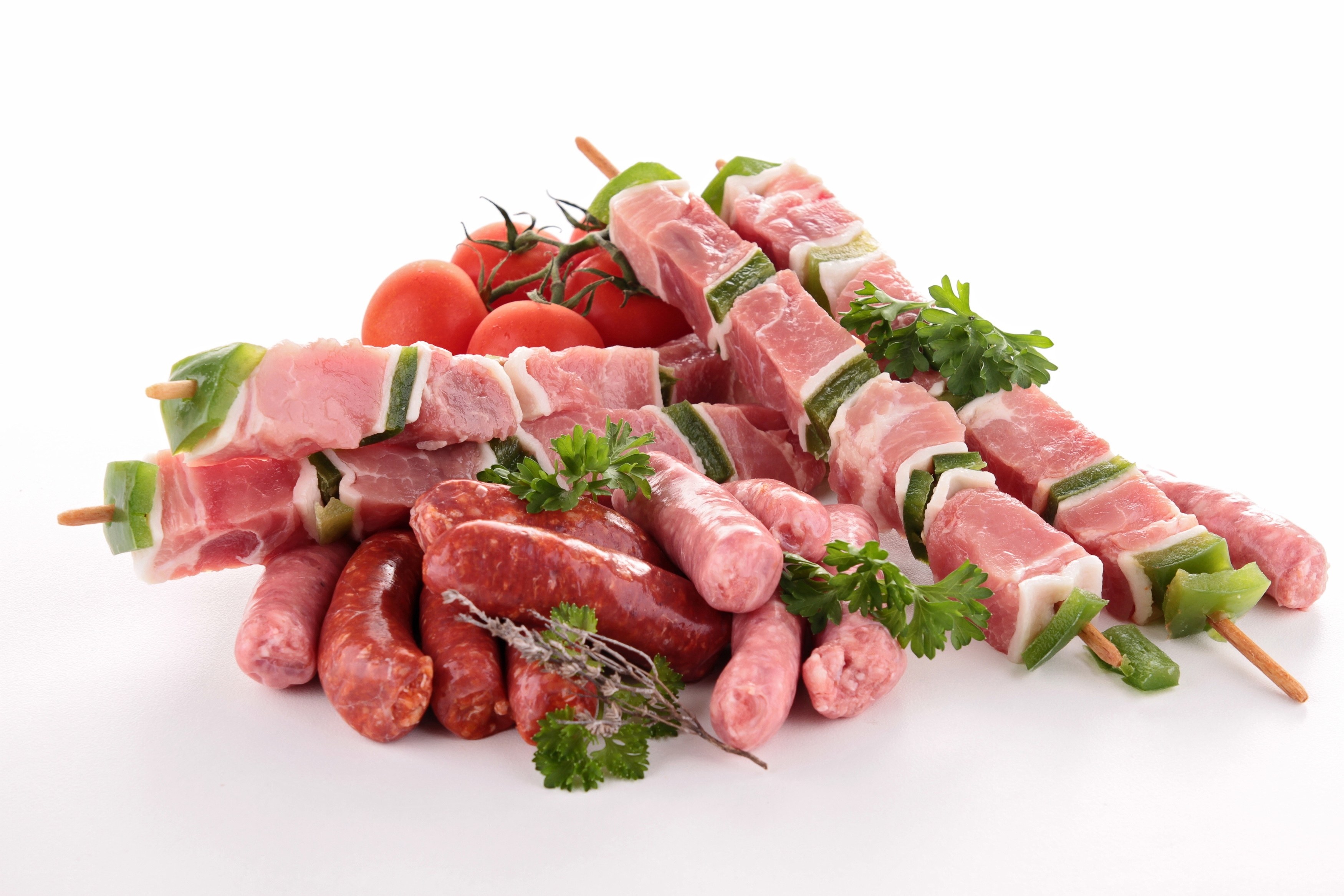 Raw meat skewers and sausages