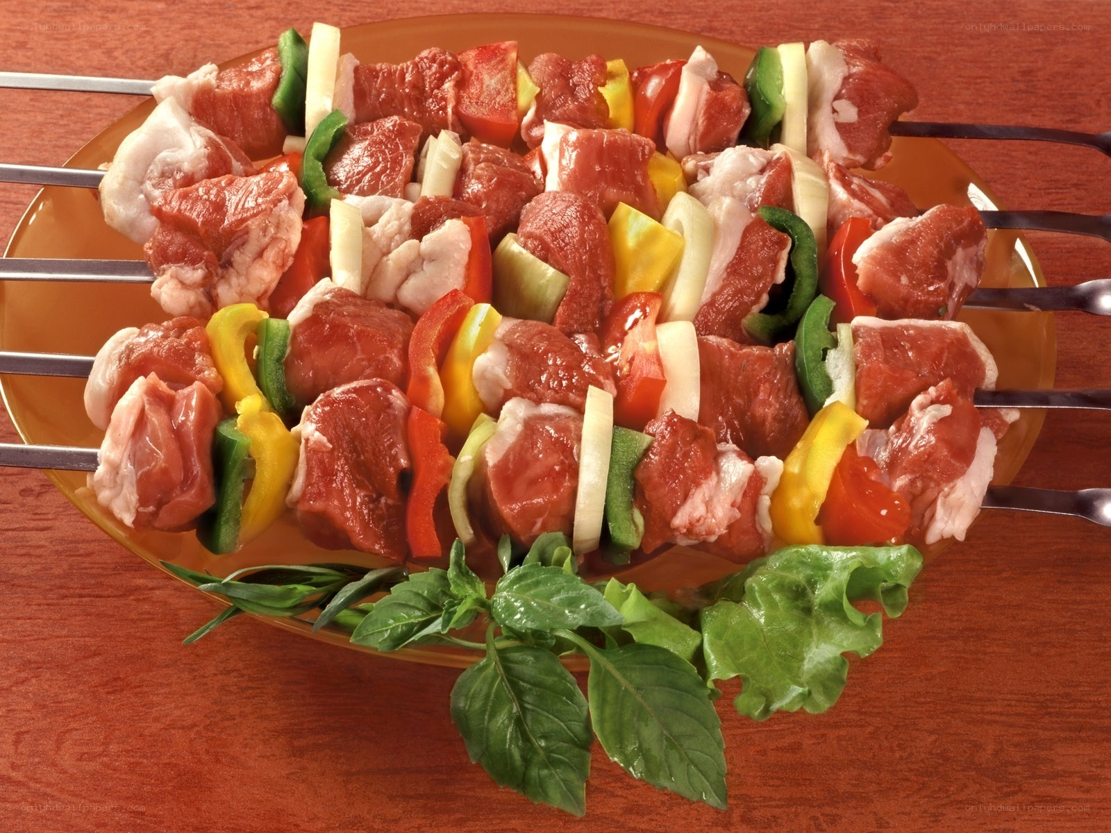 Raw meat skewers with vegetables