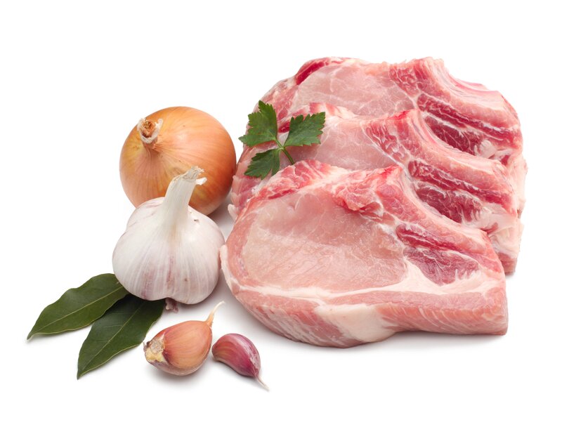 raw pork chops with herbs